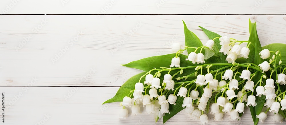 Poster top-down view of an exquisite lily of the valley arrangement on a white wooden surface, perfect for 