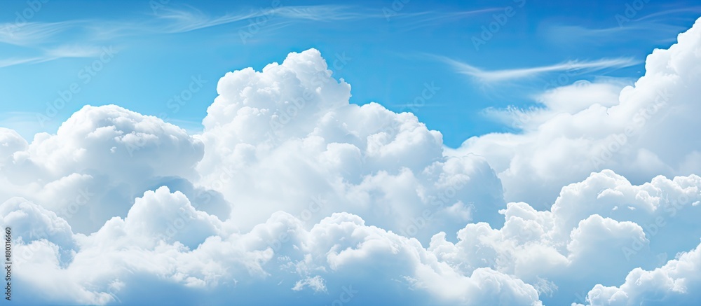 Poster soft-focused white clouds against a blue sky background with copy space image.