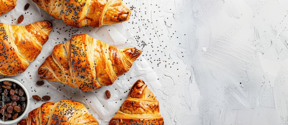 Poster pastries filled with poppy seeds and raisins displayed on a white backdrop with copy space image.