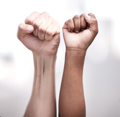 Hands, fist and people in protest for equality, human rights and diversity for peace against...