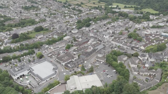 Drone view of the centre of Okehampton in Devon UK, featuring town buildings, streets, and greenery