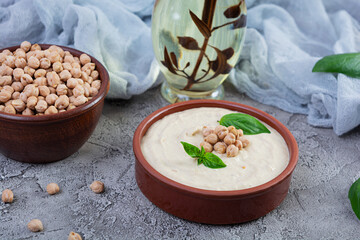 Eggplant hummus in a plate with basil. Chickpea dishes. Vegetarian food