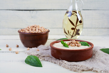 Eggplant hummus in a plate with basil. Chickpea dishes. Vegetarian food