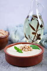 Eggplant hummus in a plate with basil. Chickpea dishes. Vegetarian food