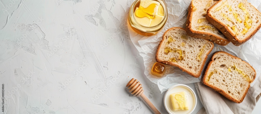 Poster Flat lay composition of sandwiches with butter honey and milk on a white table providing a copy space image