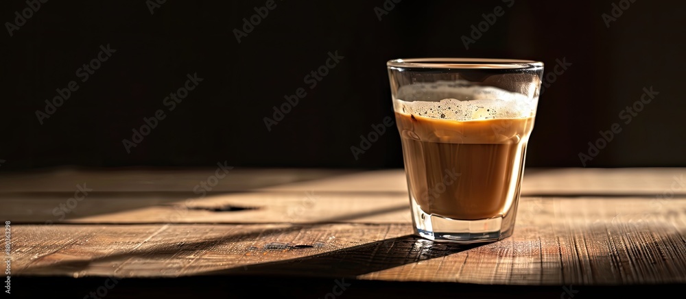 Canvas Prints Morning light illuminates a white glass of coffee on a wooden surface with a black background creating a captivating copy space image