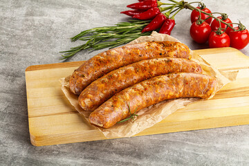 Raw sausages with spices and herbs
