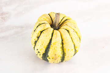 Ripe raw fresh decorative pumpkin