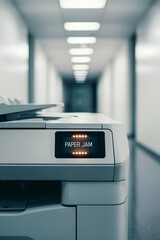 Office printer with paper jam error blinking in empty hallway