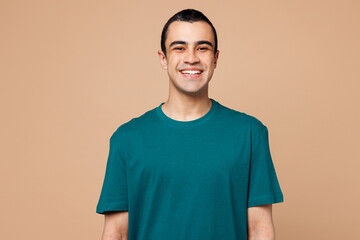 Young smiling happy cheerful satisfied positive middle eastern man wear blue t-shirt casual clothes...