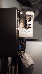 Severely damaged boiler room equipment in a private house due to a short circuit fire