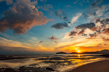 Obraz premium Landscape Long exposure of majestic clouds in the sky sunset or sunrise over sea with reflection in the tropical sea.Beautiful cloudscape scenery.Amazing light of nature Landscape nature background