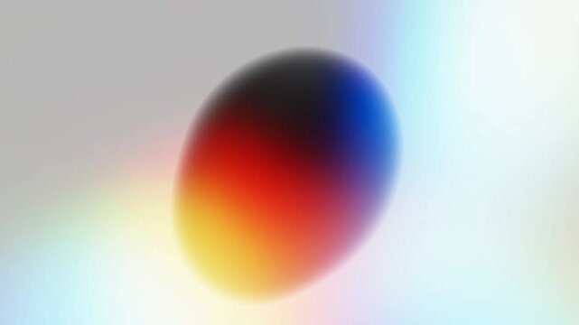 An abstract image featuring a dark oval shape in the center, with the background showcasing a colorful gradient of soft, blurred tones. The image exudes a modern and minimalistic vibe.
