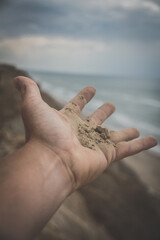 sand in hand