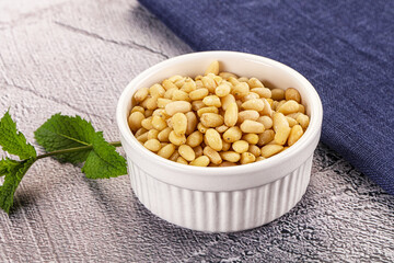 Peeled cedar nut in the bowl