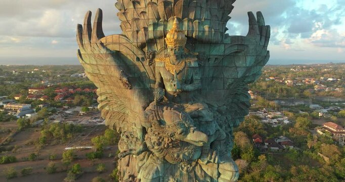 Drone Aerial view 4k Statue of Vishnu in Garuda Wisnu Kencana Cultural Park at sunrise. Bali's Most Iconic Landmark Hindu God Garuda Wisnu Kencana, Bali, indonesia.