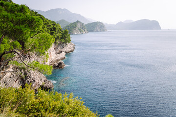 Stunning view from above of the rocks and lake. Rocky shore of mountain lake in the morning. Famous place for traveling