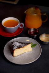 Table scene of assorted take out or delivery foods. Hamburgers, pizza, fried chicken and sides. Top down view on a dark wood banner background.