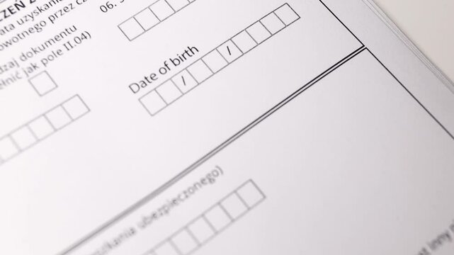 Close-up of a businesswoman fills in the date of birth. filling out the application form for a visa, for a loan