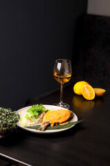 Table scene of assorted take out or delivery foods. Hamburgers, pizza, fried chicken and sides. Top down view on a dark wood banner background.