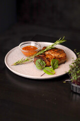 Table scene of assorted take out or delivery foods. Hamburgers, pizza, fried chicken and sides. Top down view on a dark wood banner background.