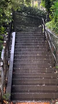 Climbing Wet Stone Steps in Heavy Rainstorm