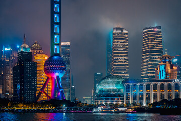 Urban skyscrapers in Shanghai at night; 