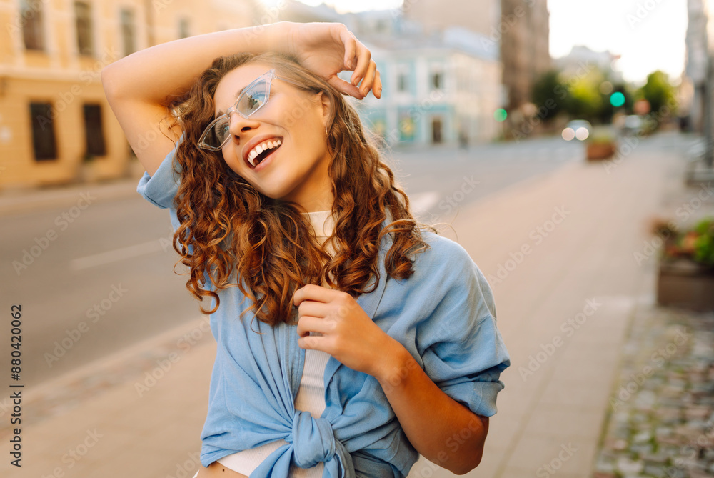 Wall mural young woman travels during student vacation holidays in street of european city. fashion, lifestyle 