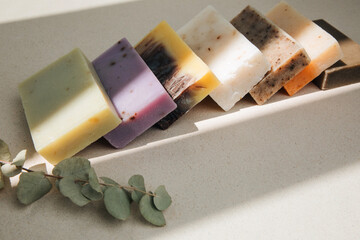 Handmade soap from natural ingredients, various herbs. Concept of sustainable use, bath products. Top view