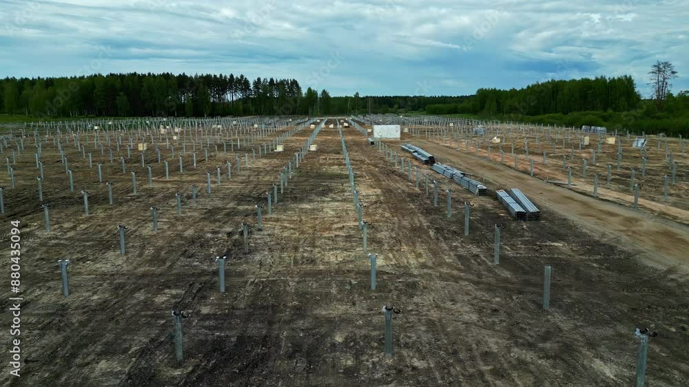 Poster aerial view of a deforested land for setup of solar panel field in latvia