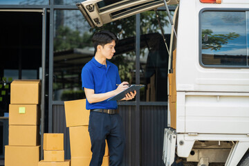 Asian delivery man work in truck for checking the product in the truck, concept ecommerce.
