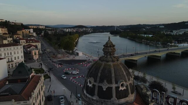 Aerial video of the Mondego River in front of downtown Coimbra, Europe, Portugal