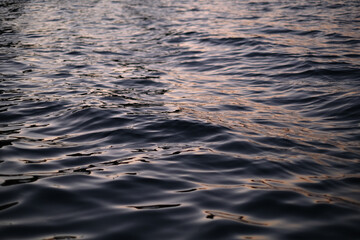 small waves on the sea during sunset close-up