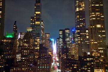 Obraz premium Aerial view of big city at night New York City. Night NY City panorama skyline at twilight. Manhattan buildings skyscraper at the morning. New York building skyscrapers skyline. Night NY city.