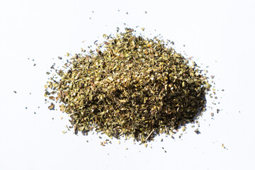 Dried herb mixture seasoning on white background, close-up, top view.