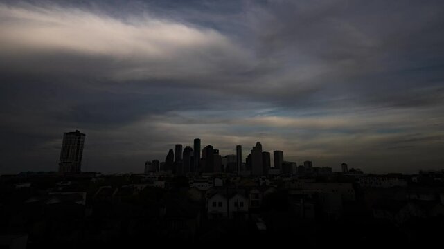 Timelapse of Houston's skyline under shifting clouds, capturing the city's dynamic energy and urban sprawl in a mesmerizing play of light and shadow.
