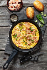 deli ham onion omelette on skillet, top view