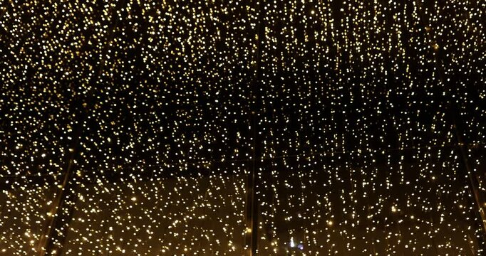 Fairy lights strung across ceiling infuse room with magical aura