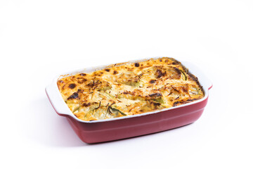 Casserole with cheese and gratin zucchini isolated on white background