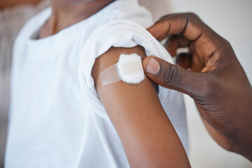 Vaccine, child and hands of person with plaster for health, wellness and injection in clinic. Healthcare, kid and doctor in hospital for immune system strength, illness prevention and flu shot on arm