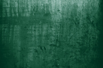 Grunge emerald green cement textured wallpaper background