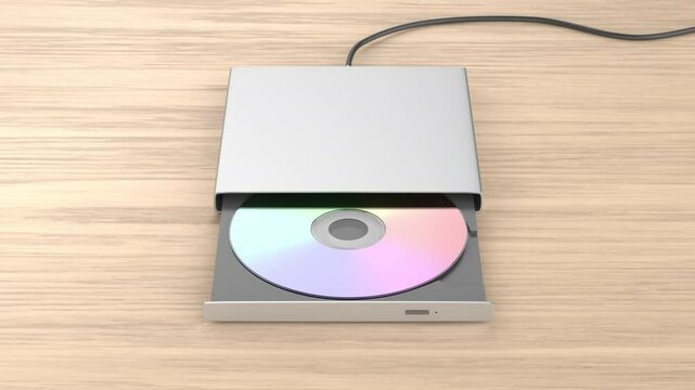 External optical disc drive on a wooden desk