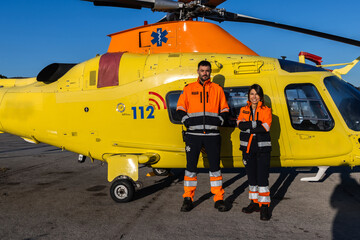 Team work of doctors standing outside the medical helicopter © Martin