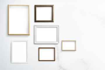 Various frame mockups hanging on a white wall