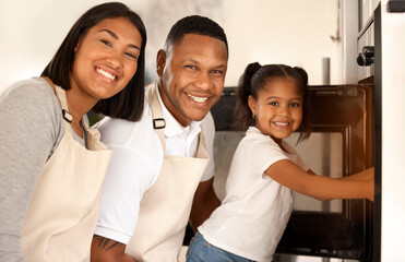 Family, kid and portrait of parents baking at oven in kitchen for learning, help or teaching girl. Happy mother, father and face of child cooking at small business, startup or bakery at stove in home