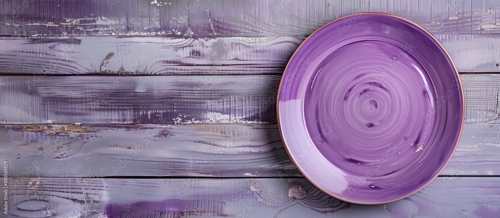 Aufkleber light wooden background with a purple plate on it creating a serene image with a copy space image