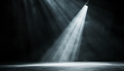 Dramatic spotlight illuminating an empty stage in a dark room, creating a moody and atmospheric scene perfect for theatrical or performance concepts.