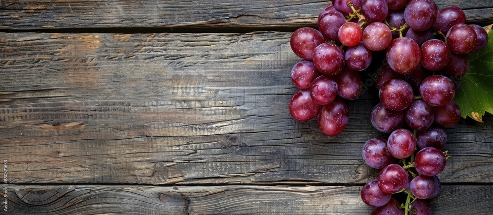 Poster grapes displayed on rustic wooden boards with copy space image