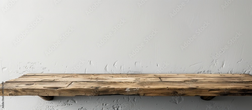 Fototapete a wooden table resting against a white wall creates a simple and elegant backdrop for any object wit