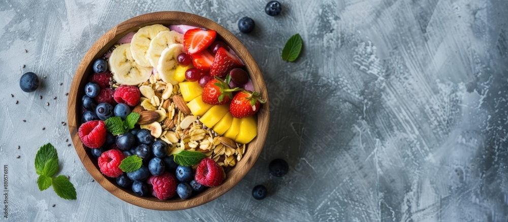 Poster boho hipster style smoothie bowl with fresh fruits on wooden bowl over a concrete table background p